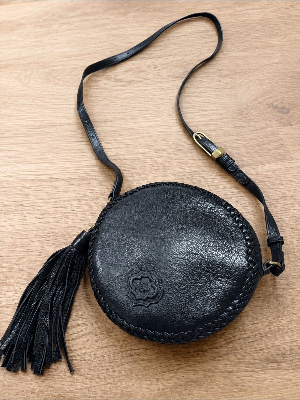 orYANY Black Leather Round Canteen Crossbody Tassel Bag